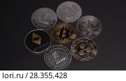 Metal coins of crypto currency LTC, ETH, BTC, XMR, XRP, DASH, on a dark background. Stop motion. Slow motion. 1080p Full HD video. Стоковое видео, видеограф Ярослав Данильченко / Фотобанк Лори