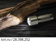 LED flashlight on a wooden pole. Стоковое фото, фотограф Alexander / Фотобанк Лори