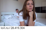 Sad Woman Sitting On The Edge Of The Bed. Стоковое видео, видеограф Pavel Biryukov / Фотобанк Лори
