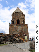 Средневековая колокольня Троицкой церкви в Гергети. Georgia, Mtskheta-Mtianeti, Kazbegi (2017 год). Редакционное фото, фотограф Алексей Гусев / Фотобанк Лори