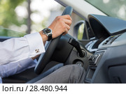 Unrecognizable man driving his car closeup. Стоковое фото, фотограф Kirill Kedrinskiy / Ingram Publishing / Фотобанк Лори