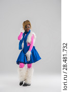 Festive african woman wearing funny costume posing on gray background. Стоковое фото, агентство Ingram Publishing / Фотобанк Лори