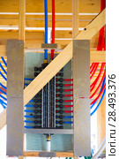 Plumbing manifold system PEX tubing for house water distribution. Стоковое фото, агентство Ingram Publishing / Фотобанк Лори