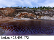Lake with red water with dissolved pyrite salts in the desert landscape of a spent quarry. Стоковое фото, фотограф Евгений Харитонов / Фотобанк Лори