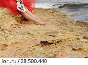 Woman in red dress holds violin and bow at sea shore. Стоковое фото, фотограф Olena Mykhaylova / Ingram Publishing / Фотобанк Лори