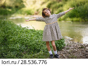 Little beautiful girl in nature stream wearing beautiful dress. Стоковое фото, фотограф Javier Sánchez Mingorance / Ingram Publishing / Фотобанк Лори