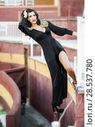 Portrait of a pretty woman, model of fashion, wearing a dress in a bullring. Spanish style. Стоковое фото, фотограф Javier Sánchez Mingorance / Ingram Publishing / Фотобанк Лори