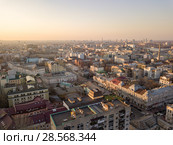 The panoramic bird's eye view from drone to the central historical part of the city Kiev - the Podol district, the Dnieper River in Kiev, Ukraine at summer sunset. Стоковое фото, фотограф Ярослав Данильченко / Фотобанк Лори