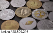 Physical metal cryptocurrency on a dark background. Digital coins cyberspace. Slow motion. 1080p Full HD video. Стоковое видео, видеограф Ярослав Данильченко / Фотобанк Лори