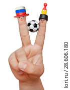 Two fingers in plasticine caps with a soccer ball, isolated on a white background. Fans of Russia and Egyptian. Стоковое фото, фотограф Элина Гаревская / Фотобанк Лори