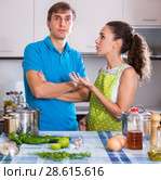Upset man and frustrated woman at kitchen. Стоковое фото, фотограф Яков Филимонов / Фотобанк Лори