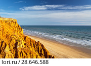 Portugal. Algarve. Unusual terracotta sculptural rocks border the sandy beaches of Falesia. Beautiful seascape (2012 год). Стоковое фото, фотограф Виктория Катьянова / Фотобанк Лори