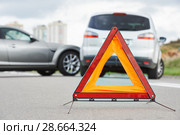 Accident or crash with two automobile. Road warning triangle sign in focus. Стоковое фото, фотограф Дмитрий Калиновский / Фотобанк Лори
