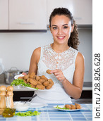 girl with tasty breadcrumbed crocchette. Стоковое фото, фотограф Яков Филимонов / Фотобанк Лори