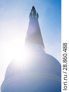 Upper part of the Buddhist stupa against the sun (2018 год). Стоковое фото, фотограф Евгений Харитонов / Фотобанк Лори