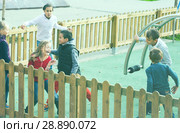 Positive kids running around while playing. Стоковое фото, фотограф Яков Филимонов / Фотобанк Лори