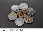 Coins of crypto currency are presented on a dark background. Virtual money concept. Стоковое фото, фотограф Ярослав Данильченко / Фотобанк Лори