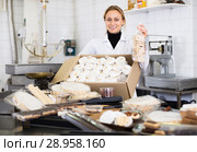 Female with box of turron in production workplace. Стоковое фото, фотограф Яков Филимонов / Фотобанк Лори