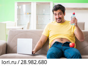 The man suffering from extra kilos in dieting concept. Стоковое фото, фотограф Elnur / Фотобанк Лори