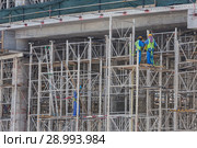 Team of construction worker on construction site. Стоковое фото, фотограф Matej Kastelic / Фотобанк Лори