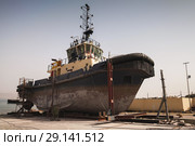 Old tugboat for repair at dock (2018 год). Стоковое фото, фотограф EugeneSergeev / Фотобанк Лори