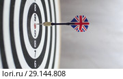Side сlose-up of dart hitting bullseye on black-white dartboard. Стоковое видео, видеограф Uladzimir Sitkouski / Фотобанк Лори