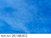 Celestial background - blue day sky with white cirro-cumulus clouds. Стоковое фото, фотограф Евгений Харитонов / Фотобанк Лори