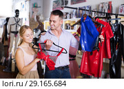Assistant helping customer shopping seductive frillies. Стоковое фото, фотограф Яков Филимонов / Фотобанк Лори