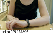 Young girl press on futuristic user interface concept bracelet. Graphical User Interface - GUI. Head up Display - HUD. Internet of things. Стоковое видео, видеограф Dzmitry Astapkovich / Фотобанк Лори