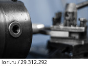 Background - detail of the machine, the spindle of turning lathe while working close up, the background is blurred. Стоковое фото, фотограф Евгений Харитонов / Фотобанк Лори