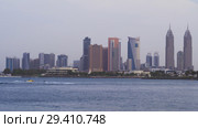 Coastal skyscrapers of Jumeirah district in Dubai in the evening (2018 год). Редакционное фото, фотограф Юлия Машкова / Фотобанк Лори