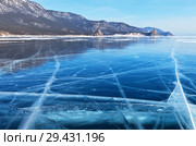 Lake Baikal in winter. View from the ice on the Sandy Bay (Peschanaya Bay) and the rocks of the Big and Small Belltower (Kolokolny) Стоковое фото, фотограф Виктория Катьянова / Фотобанк Лори