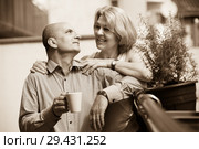 Couple drinking coffee at balcony. Стоковое фото, фотограф Яков Филимонов / Фотобанк Лори