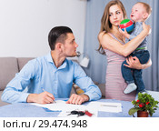 Gloomy male signing documents. Стоковое фото, фотограф Яков Филимонов / Фотобанк Лори