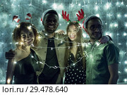 A group of friends celebrate the new year. Стоковое фото, фотограф Женя Канашкин / Фотобанк Лори
