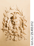 Perm, Russia - November 24, 2018: tiled panel with a bas-relief on an old fireplace of the XIX century. Редакционное фото, фотограф Евгений Харитонов / Фотобанк Лори