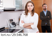 Upset girl with husband in kitchen furniture salon. Стоковое фото, фотограф Яков Филимонов / Фотобанк Лори