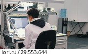Industrial production. A man looks at the parameter on PC. Стоковое видео, видеограф Константин Шишкин / Фотобанк Лори