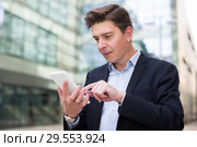 Professional man working at electonic device. Стоковое фото, фотограф Яков Филимонов / Фотобанк Лори