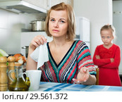 Upset girl and mother have a peeve on each other. Стоковое фото, фотограф Яков Филимонов / Фотобанк Лори