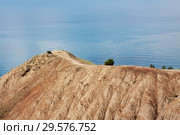 View from the top of the mountain to the Black SeView from the top of the mountain to the Black Sea and to Cape Rybachiy. A narrow path runs along the edge of the cape. Republic of Crimea, Russia. Стоковое фото, фотограф Владимир Пойлов / Фотобанк Лори