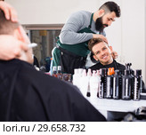 Male hairdresser accurately cutting beard. Стоковое фото, фотограф Яков Филимонов / Фотобанк Лори