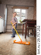 girl mops the floor at home. Стоковое фото, фотограф Типляшина Евгения / Фотобанк Лори