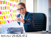 Beautiful female employee with many conflicting priorities. Стоковое фото, фотограф Elnur / Фотобанк Лори