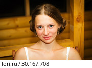 Portrait of a fair-haired smiling girl. A close-up portrait of a horizontal format, made in the evening in a summer terrace with artificial lighting. Стоковое фото, фотограф Вадим Орлов / Фотобанк Лори