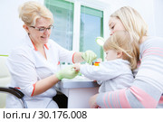 Blood medical test or research. Taking a blood sample from child finger in hospital. Стоковое фото, фотограф Дмитрий Калиновский / Фотобанк Лори