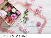 rose, desset and candles on white wooden background. Стоковое фото, фотограф Майя Крученкова / Фотобанк Лори