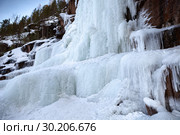 Frozen ice on rocks from a waterfall in the mountains. Стоковое фото, фотограф Restyler Viacheslav / Фотобанк Лори