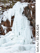 Frozen ice on rocks from a waterfall in the mountains. Стоковое фото, фотограф Restyler Viacheslav / Фотобанк Лори