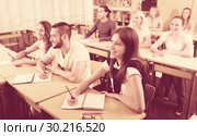 Happy students in college classroom. Стоковое фото, фотограф Яков Филимонов / Фотобанк Лори